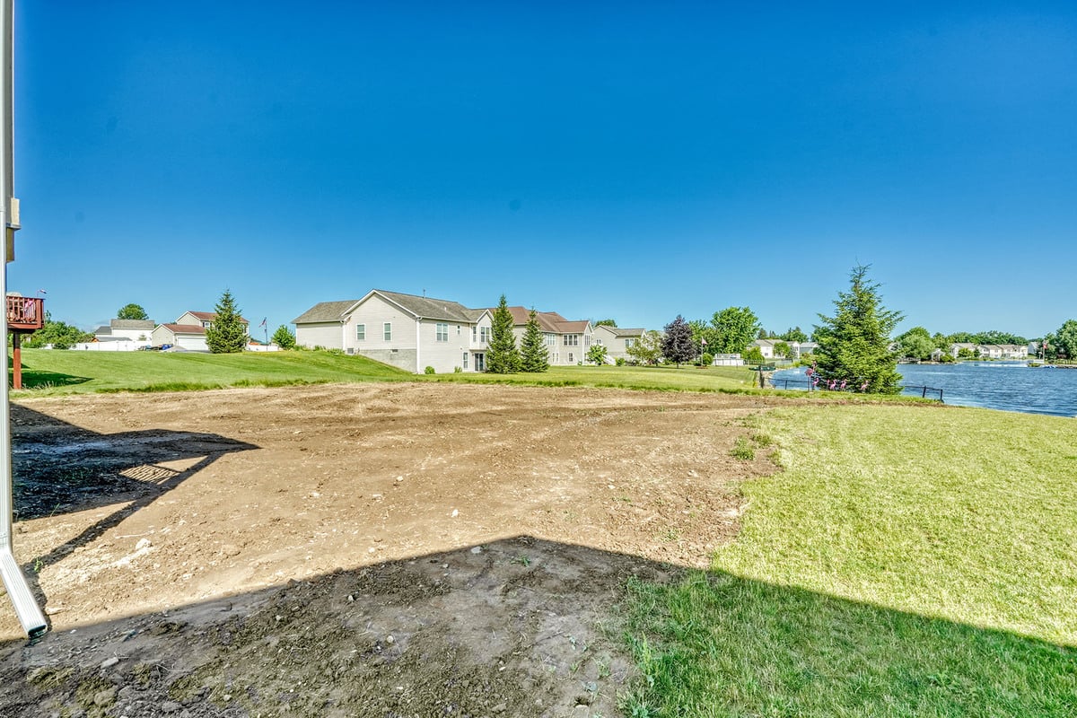 Cleared land on sunny day in greater Rochester, NY for new construction by Gerber Homes